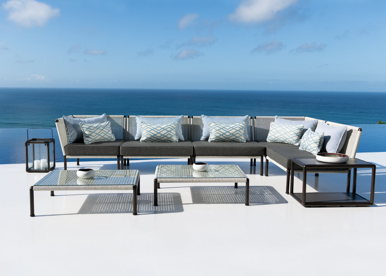 Porto, modular sofa collection with bronze frame and outdoor-rope detailing.